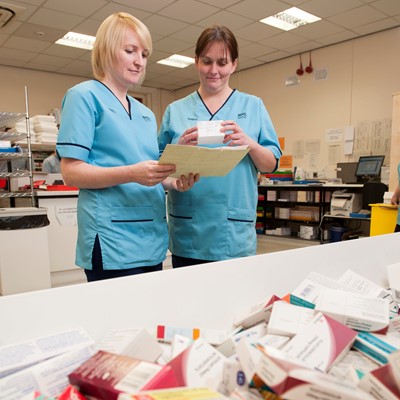 Two nurses in hospital pharmacy
