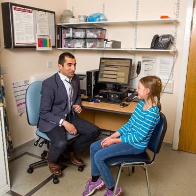 GP and teenage patient in surgery