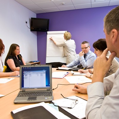 People sitting round table, learning, meeting